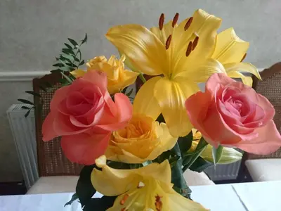 a bouquet of flowers in a vase on a table at Bankside Bed & Breakfast in St Austell