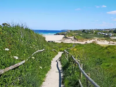 a path leading down a hill to a beach at Ash in Scorrier