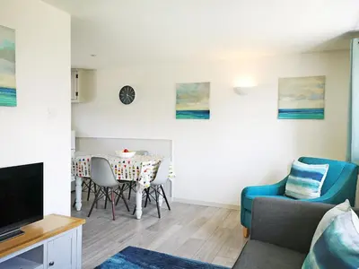 a living room with a table and chairs at Elm - 31304 in Porthtowan