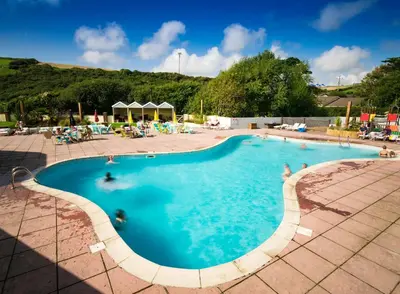 a large swimming pool with people in it at Newquay Bay Holiday Resort in Newquay