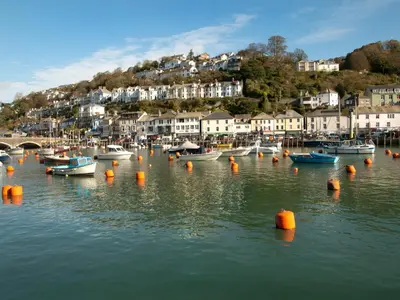 a group of boats in the water in a harbor at Trelawne Manor Holiday Park in Looe