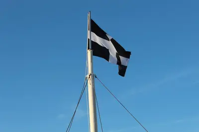 a flag flying on top of a boat at Seaside Apartment in Newquay