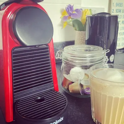 a red toaster sitting on a counter next to a drink at Fistral Studio in Newquay