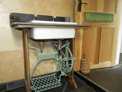 a sink on a stand in a bathroom at Neptunes Rest in St Austell