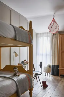 a bedroom with a bunk bed and a desk at Fowey Hall Hotel in Fowey