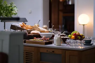 a table full of food on top of a counter at Fowey Hall Hotel in Fowey