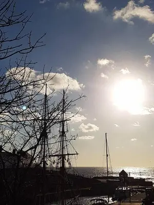 a sail boat is docked on the beach at Sea Haze Charlestown in St Austell