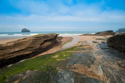 a view of a beach with rocks and the ocean at Bay Retreat Villas in Padstow