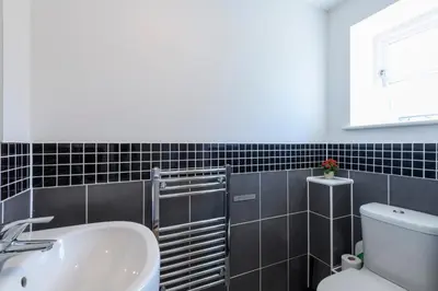 a bathroom with a sink and a toilet at Bay Retreat Villas in Padstow