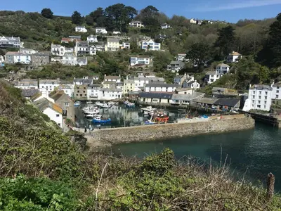 a town on a hill with a body of water at The Claremont Hotel-Adult Only in Polperro