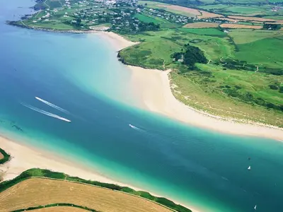 an aerial view of a beach and the ocean at Bay Retreat Villas in St Merryn