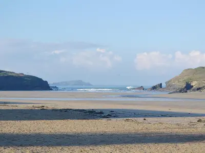 a sandy beach with a view of the ocean at Bay Retreat Villas in St Merryn