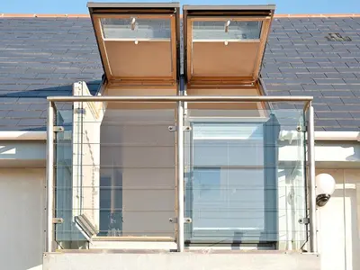 two windows on the side of a house at Bay Retreat Villas in St Merryn