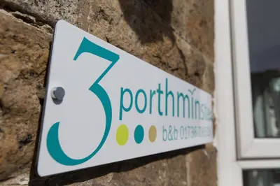 a sign on the side of a brick building at 3 Porthminster B&B in St Ives