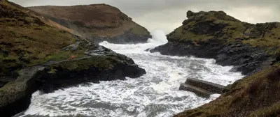 an aerial view of a raging river with rocks at The Old Coach House in Boscastle