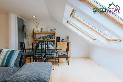 a living room with a table and chairs at 