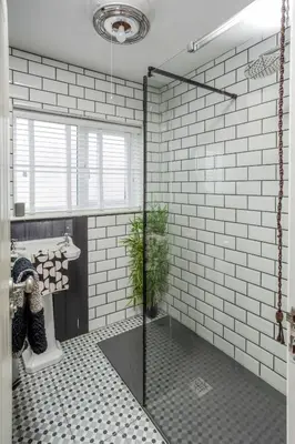 a bathroom with a shower with a glass door at The Bunker House in Newquay