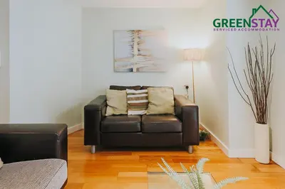 a black leather couch in a living room at 