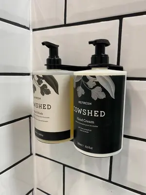 two bottles ofumped on a tiled wall at 