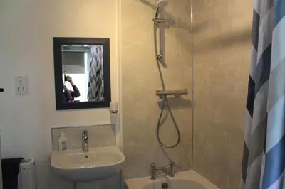 a bathroom with a shower and a sink and a shower at Tom in Bodmin