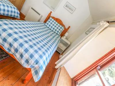 an overhead view of a bedroom with a bed and a window at Uphill Cottage in Saint Ervan