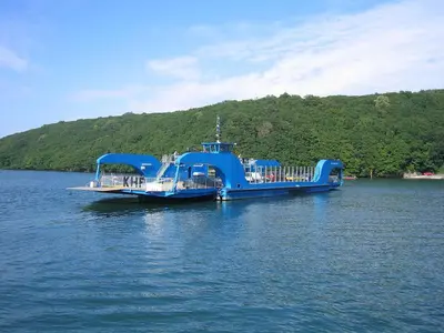 a large blue boat in a large body of water at Quarry Cottage in Flushing