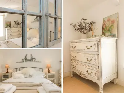a bedroom with a dresser and a mirror at Evergreen in Breage
