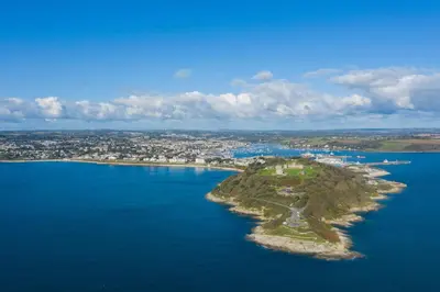 an island in the middle of a body of water at Falmouth Self Catering Lodges in Falmouth