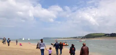 a group of people walking on the beach at Cyntwell Guest Accommodation in Padstow