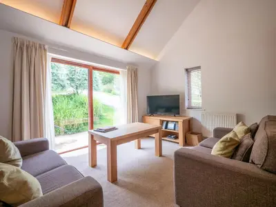 a living room with a couch and a table at The Valley in Perranwell