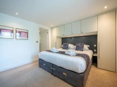 a bedroom with a large bed in a room at The Valley in Perranwell