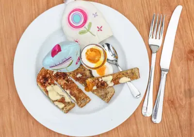 a white plate with breakfast food on a table at Treweens in Wadebridge