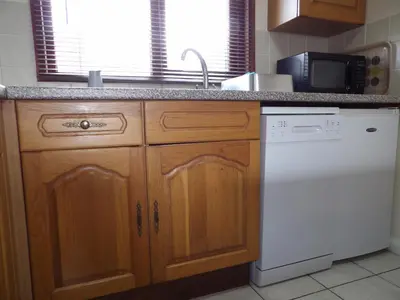 a kitchen with a sink and a dishwasher at Hengar Select in Saint Tudy
