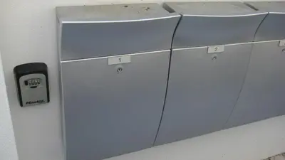 a metal refrigerator is next to a wall at SeaQuest 1 in Newquay