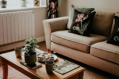 a living room with a couch and a coffee table at Higher Trewithen in Stithians