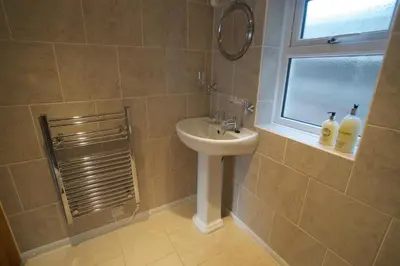 a bathroom with a sink and a window at Chynoweth Mews in Newquay