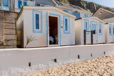 a beach house on the beach at Tolcarne Beach Cabins in Newquay