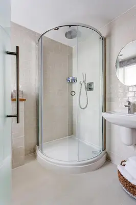 a bathroom with a shower and a sink at The Idle Rocks in Saint Mawes