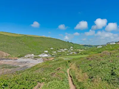 a small village on a hill with a dirt road at Beckaveans Granary in Jacobstow