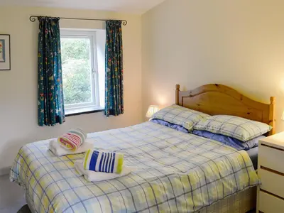 a bedroom with two beds and a window at Every in Saint Kew