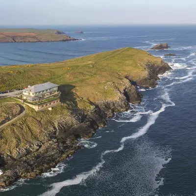 an aerial view of a house on an island in the ocean at 6 Ocean Gate apartment in Newquay