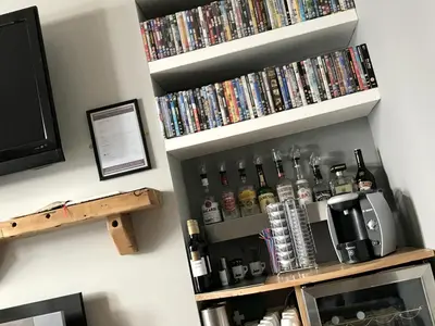 a bunch of dvds are on a wall at St Bernards in Newquay