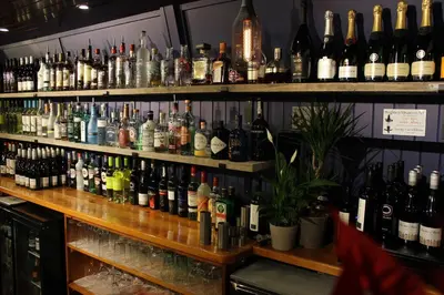 a bar filled with lots of bottles of alcohol at The Pityme Inn in Wadebridge