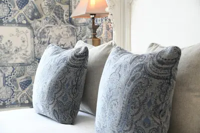 two pillows sitting on top of a couch at Padstow Townhouse in Padstow