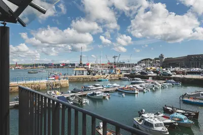 a bunch of boats docked in a harbor at Chainlocker in Falmouth
