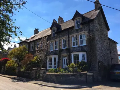 an old stone house on the side of a street at Brookdale House in Wadebridge