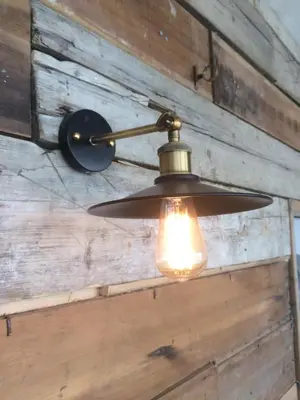 a ceiling light hanging from a wooden wall at Pentire Newquay Cornwall Hotel in Newquay