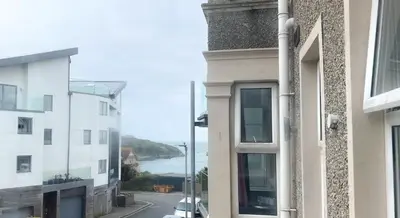 a view of the ocean from a building at Reef Lodge in Newquay