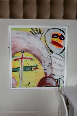 a painting in a white frame on a refrigerator at Bedlam House in Newquay