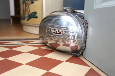 a metal object sitting on a floor next to a door at Bedlam House in Newquay